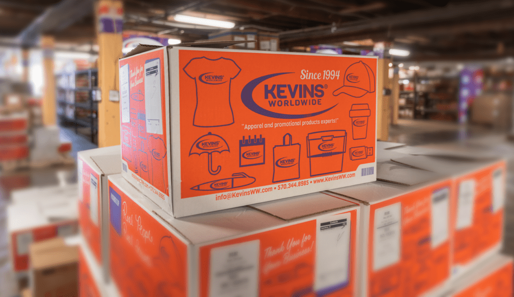 A stack of Kevins Worldwide boxes in the fulfillment warehouse. The background is blurred out.